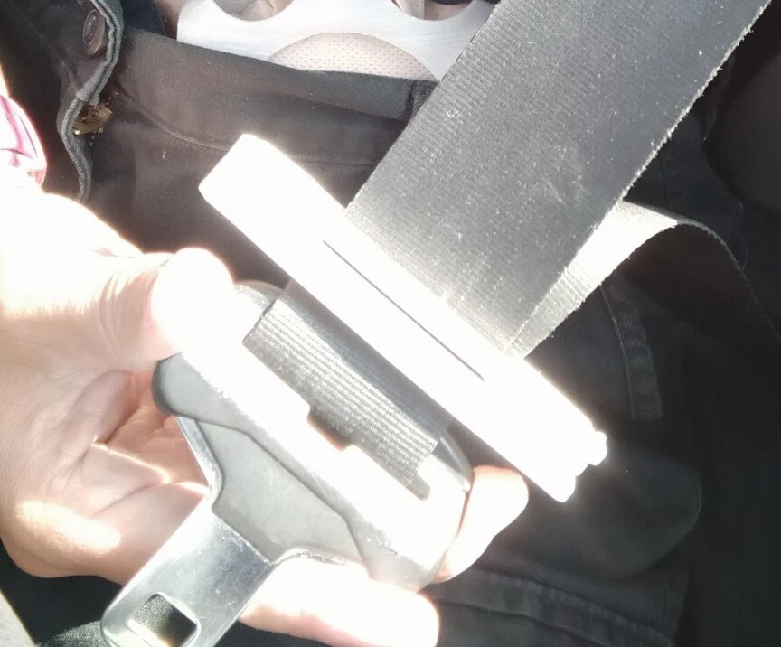 Seatbelt stoma protector in use during driving